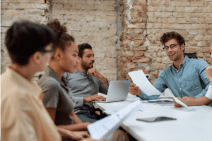 Facilitator leading a workshop showcasing the LEGO® Serious Play® Method potential with engaged participants building models.